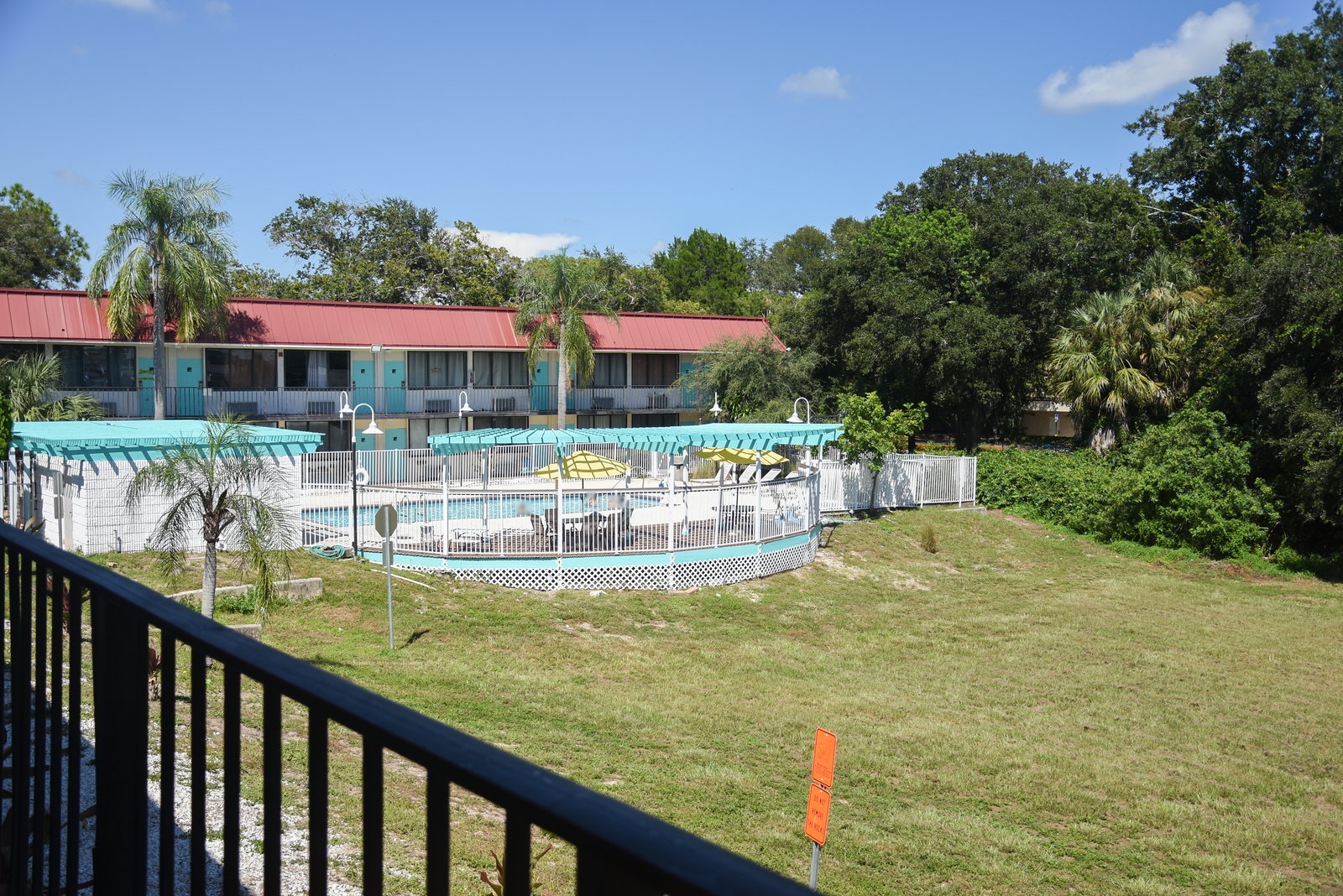 Lawn, pool and the two-story building